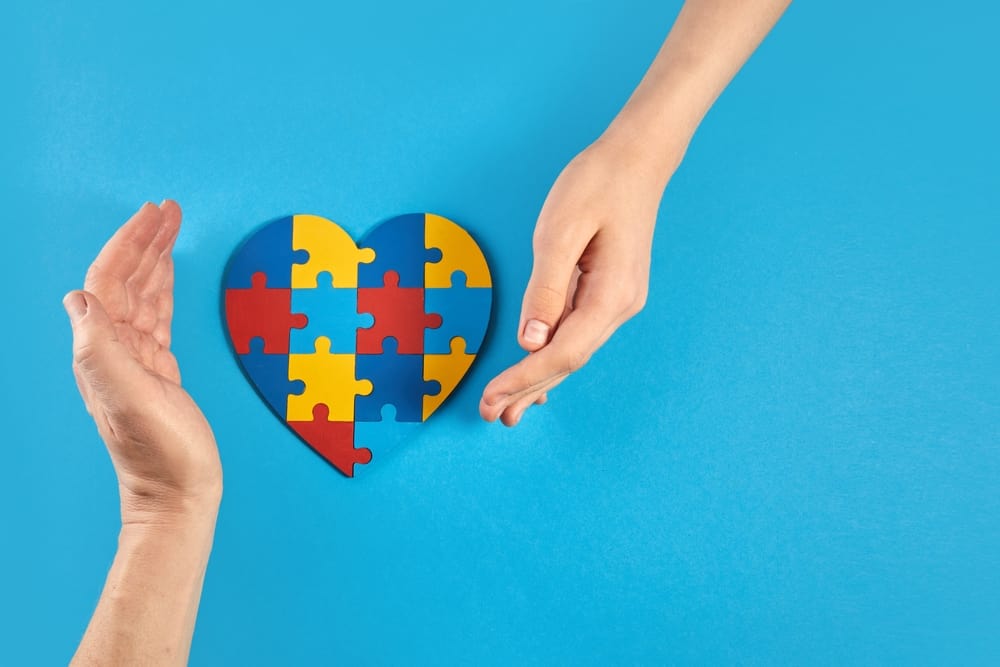 autism puzzle pieces in shape of a heart.